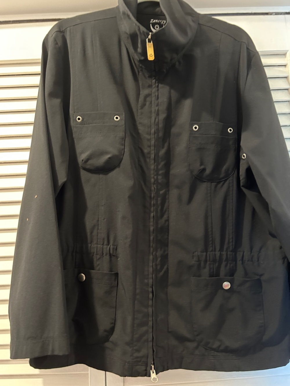 Chicos Zenergy black jacket w full length zipper trimmed with silver rivets.M